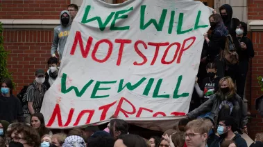 Pro-Palestinian protesters march down East 13th Ave during a rally on the University of Oregon campus in support of a cease fire in Gaza.